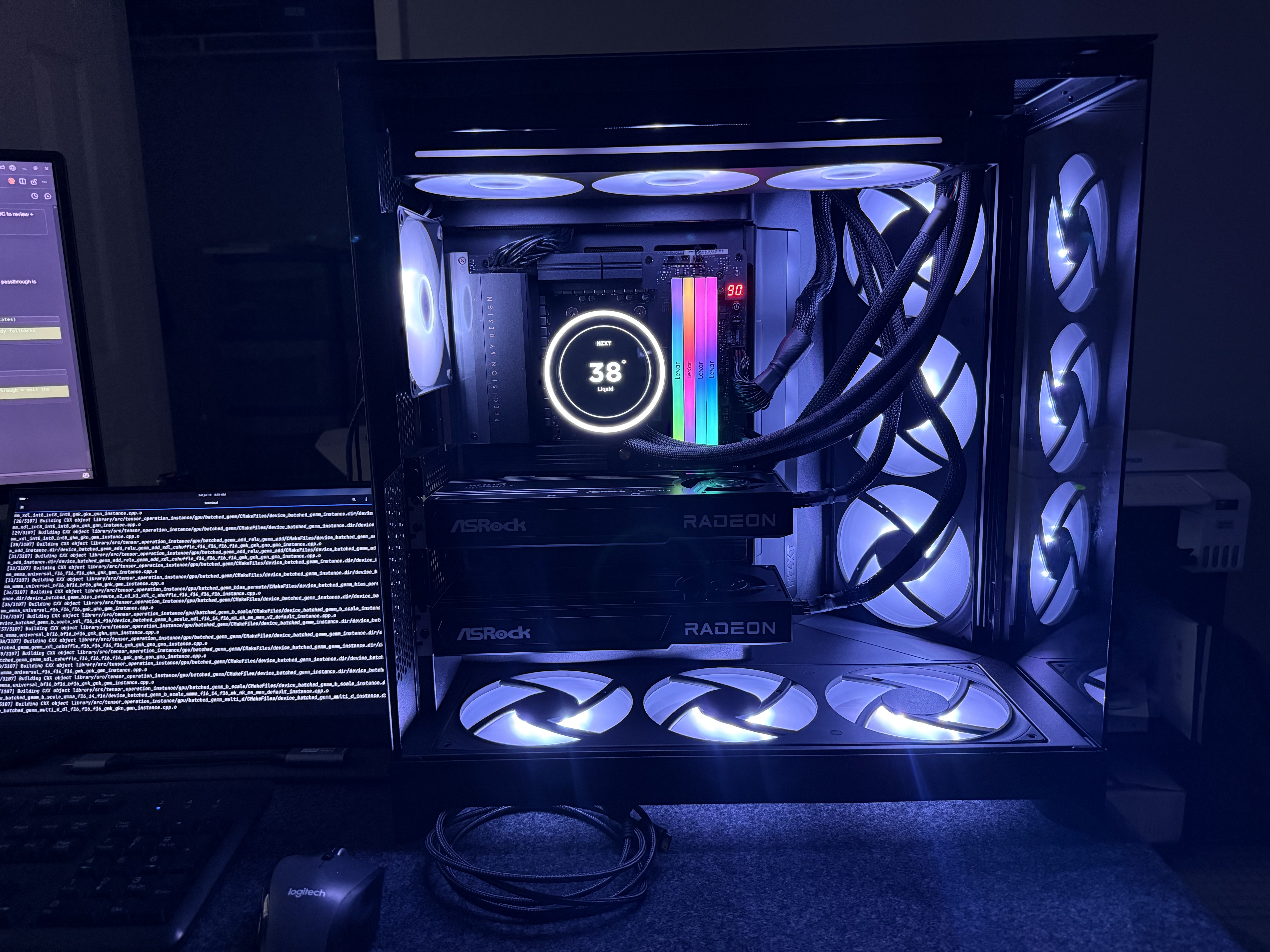 An open dual-GPU workstation case, liquid cooler reading 38 degrees, two AMD Radeon graphics cards installed, mid-build